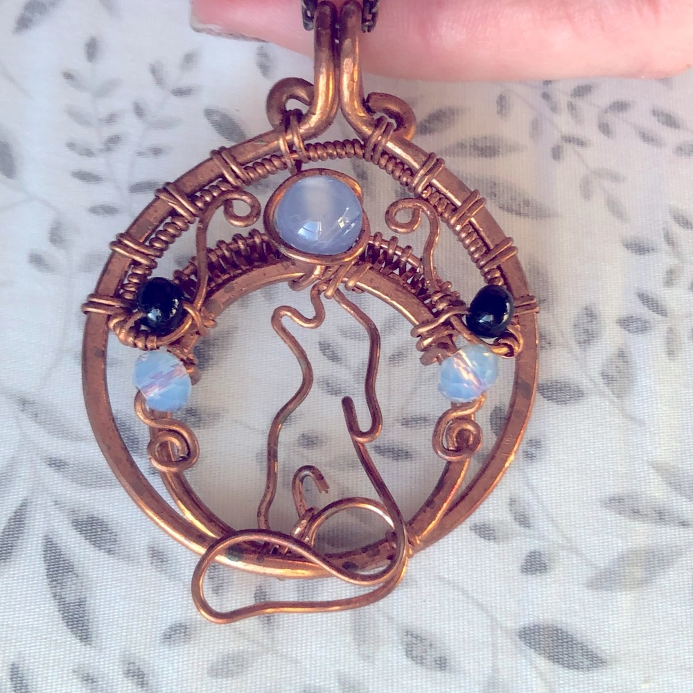 Copper wolf medallion